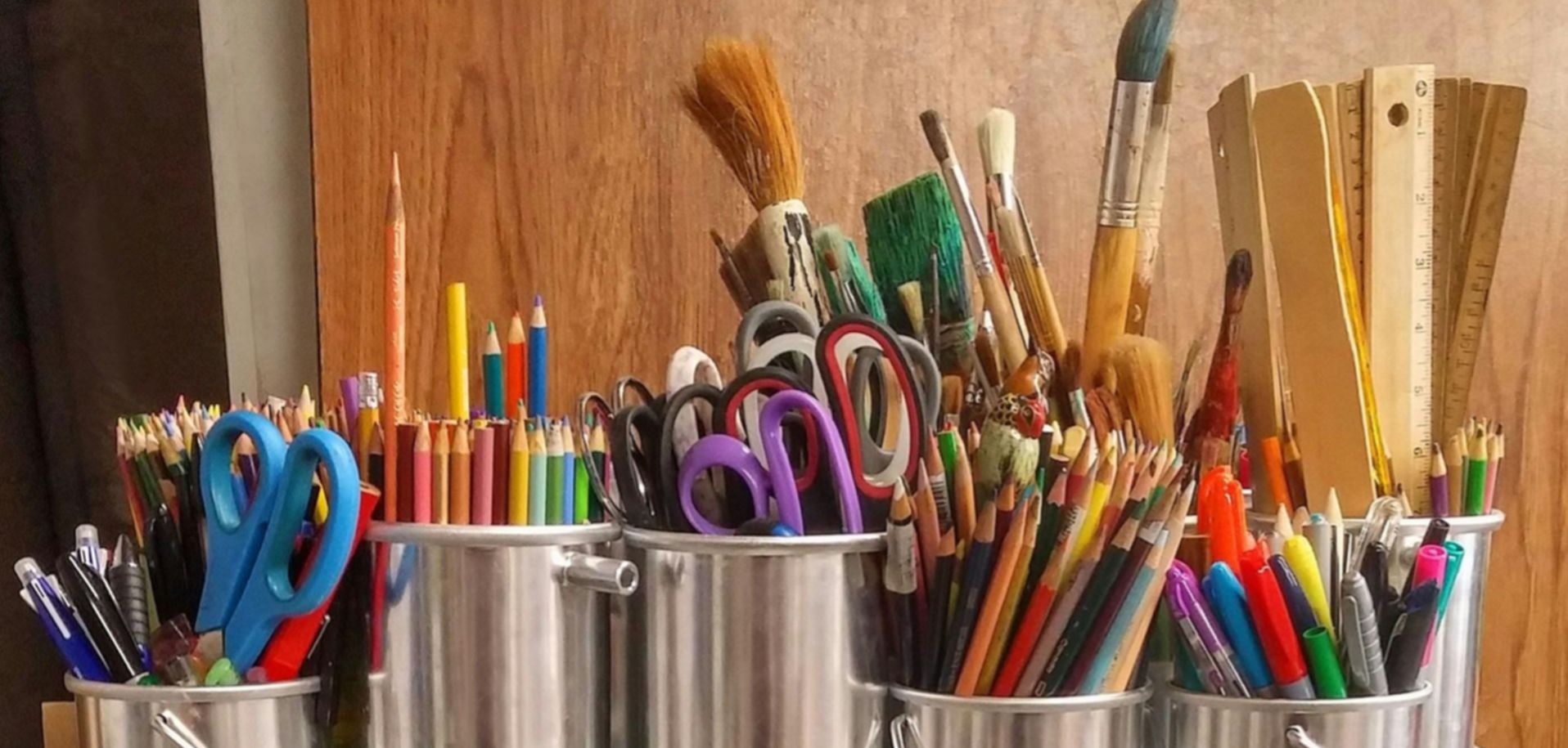 image of volunteers packing a box with canned goods
