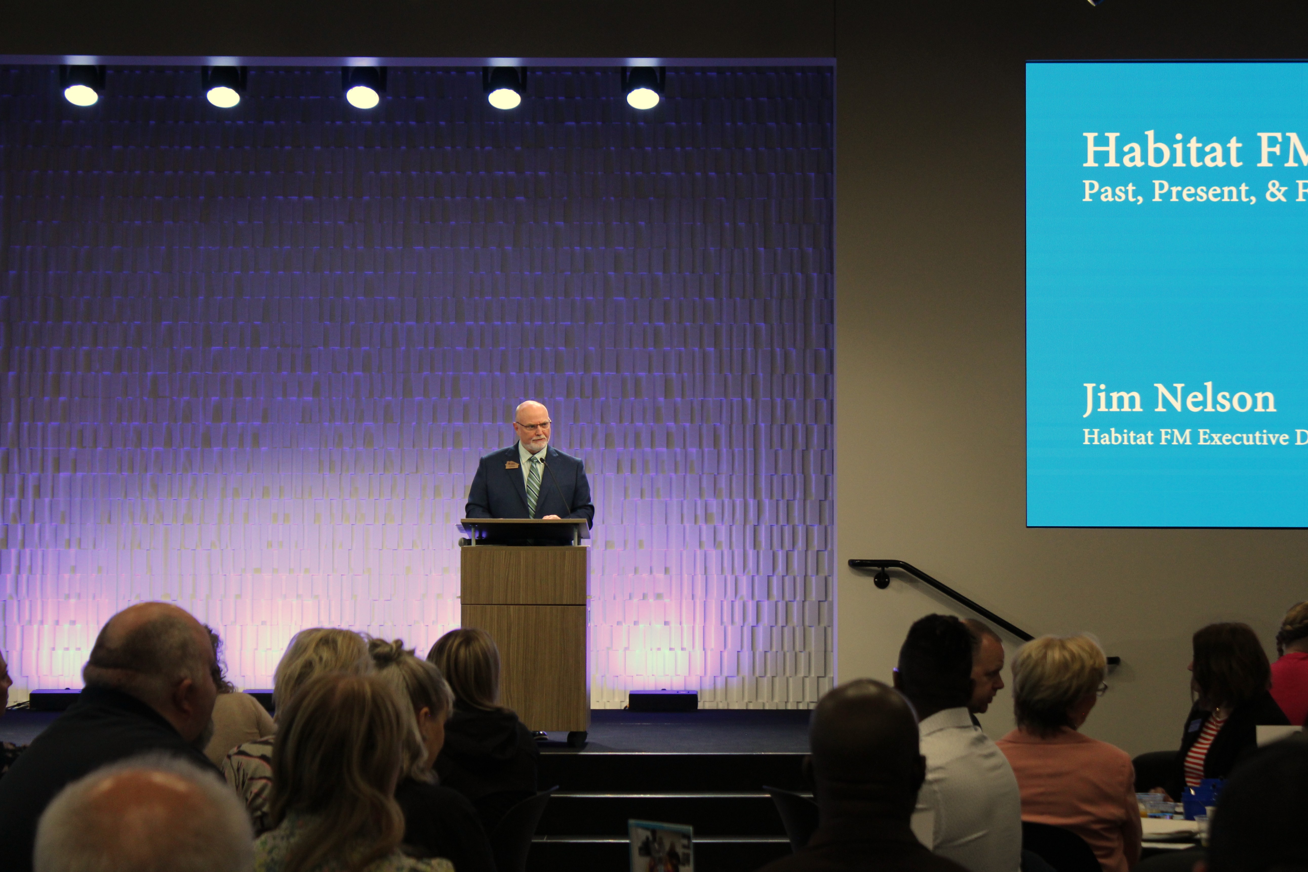 Photograph of Habitat FM Executive Director Jim Nelson speaking at the Hard Hat Breakfast on Tuesday, May 12, 2026.