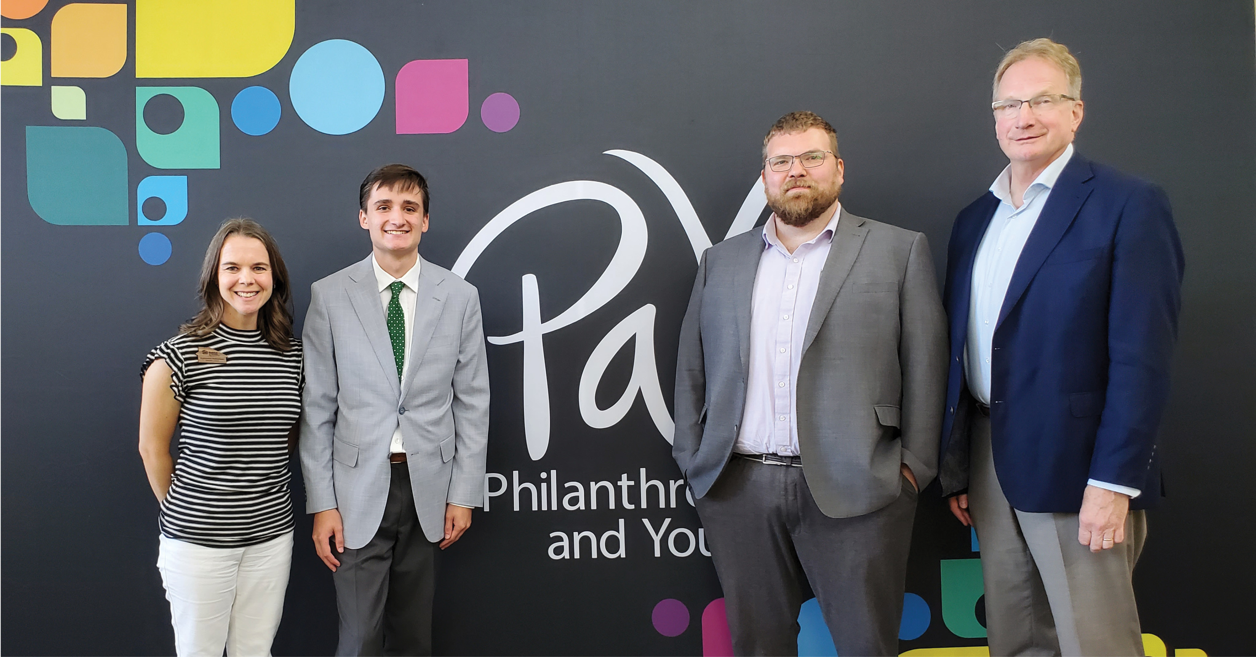 A photograph of Habitat FM's Katherine Halvorson and Davin Wait with Harrison Shewey and Mike Hagstrom.